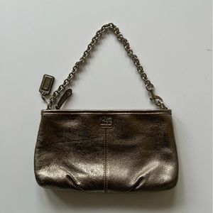Gently used Coach metallic clutch.